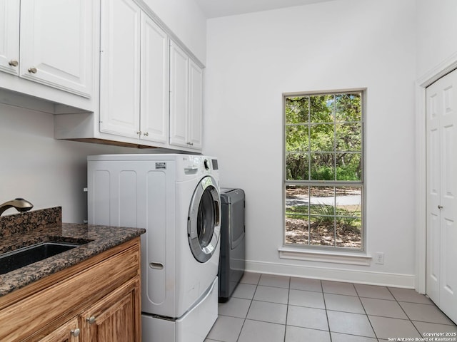 6 De Zavala, Shavano Park, TX 78231 - laundry room with independent washer and dryer, cabinet space, light tile patterned flooring, and plenty of natural light