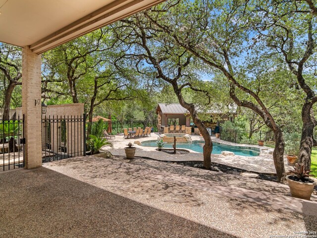 6 De Zavala, Shavano Park, TX 78231 - view of patio / terrace featuring a pool with connected hot tub and an outdoor structure