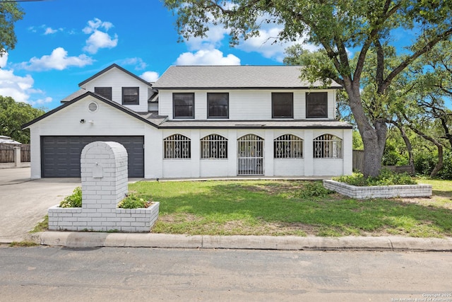 1654 Rob Roy, San Antonio, TX 78251 - view of front of house featuring an attached garage, a front lawn, driveway, covered porch, and roof with shingles
