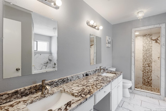 1654 Rob Roy, San Antonio, TX 78251 - bathroom with double vanity, marble finish flooring, and tiled shower