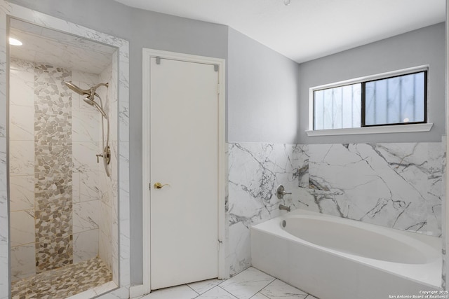 1654 Rob Roy, San Antonio, TX 78251 - full bathroom featuring a bath, marble look tile flooring, a marble finish shower, and tile walls
