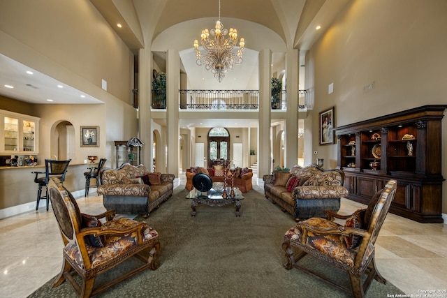 2 Admirals Way, San Antonio, TX 78257 - living room with a towering ceiling, arched walkways, a chandelier, and recessed lighting
