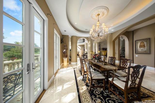 2 Admirals Way, San Antonio, TX 78257 - dining space with arched walkways, a chandelier, and a tray ceiling