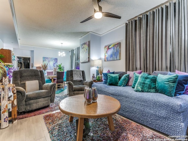 1 Towers Park Unit 211, San Antonio, TX 78209 - living room with a textured ceiling, a chandelier, and a ceiling fan