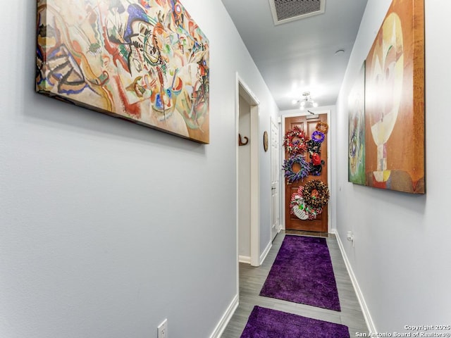 1 Towers Park Unit 211, San Antonio, TX 78209 - doorway to outside featuring baseboards and wood finished floors