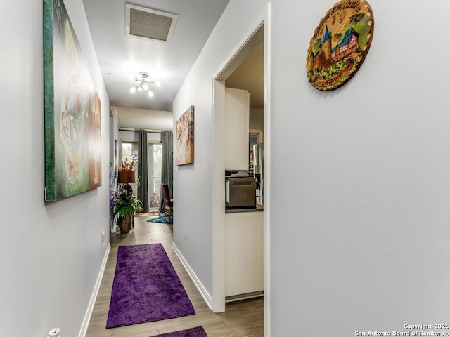 1 Towers Park Unit 211, San Antonio, TX 78209 - corridor featuring wood finished floors and baseboards