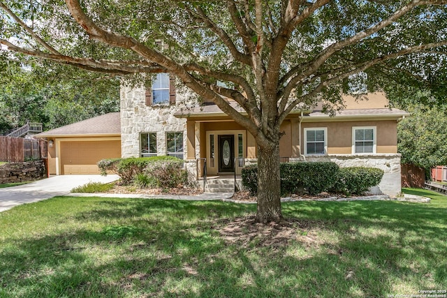 3501 Big Horn, Schertz, TX 78154 - obstructed view of property featuring stone siding, a garage, concrete driveway, and stucco siding