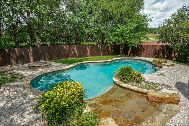 3501 Big Horn, Schertz, TX 78154 - view of pool with a fenced backyard, an outdoor fire pit, and a patio