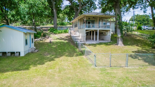 9071 Fm 725, Mcqueeney, TX 78123 - rear view of property with ceiling fan, stairs, a fenced backyard, a gate, and a deck