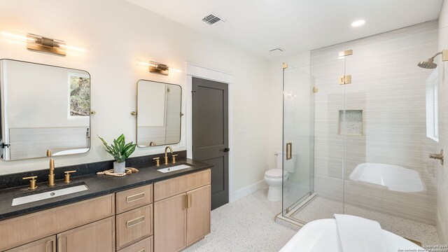 3140 Westview, Canyon Lake, TX 78133 - bathroom featuring a shower stall, double vanity, a freestanding tub, and recessed lighting