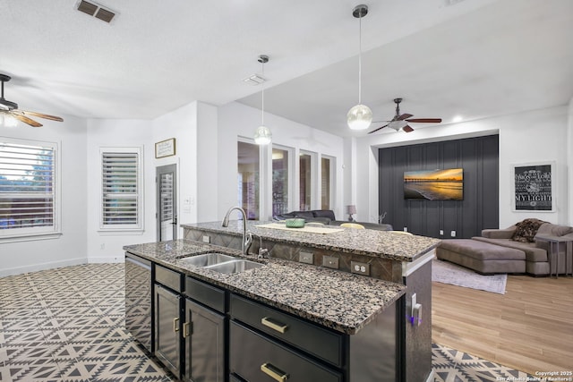 1162 Thunder Cloud, Spring Branch, TX 78070 - kitchen with ceiling fan, open floor plan, a kitchen island with sink, and hanging light fixtures