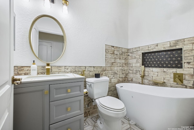 1162 Thunder Cloud, Spring Branch, TX 78070 - full bathroom with a freestanding bath, tile walls, vanity, wainscoting, and tile patterned flooring