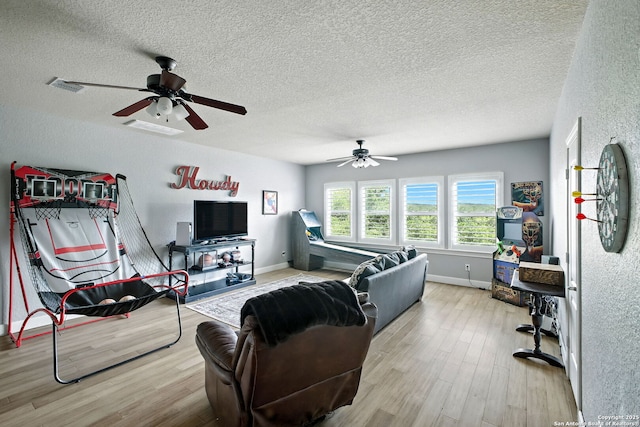 1162 Thunder Cloud, Spring Branch, TX 78070 - living room with ceiling fan, wood finished floors, and a textured ceiling