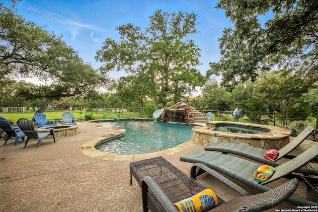 1162 Thunder Cloud, Spring Branch, TX 78070 - view of pool featuring a water slide, an outdoor fire pit, a patio, a pool with connected hot tub, and view of wooded area