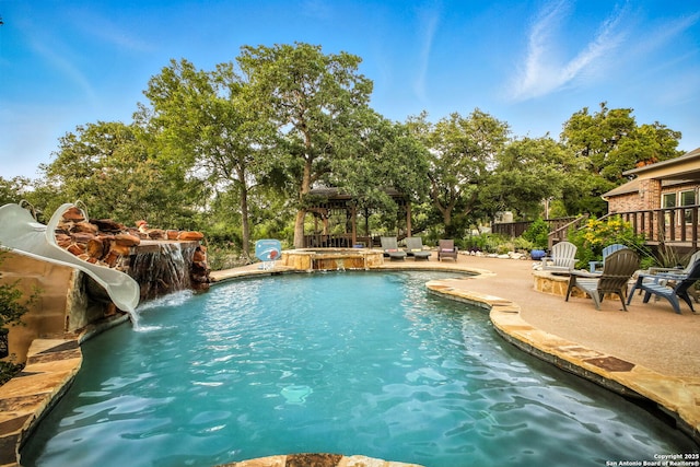 1162 Thunder Cloud, Spring Branch, TX 78070 - view of pool with a water slide, a patio, and a pool with connected hot tub