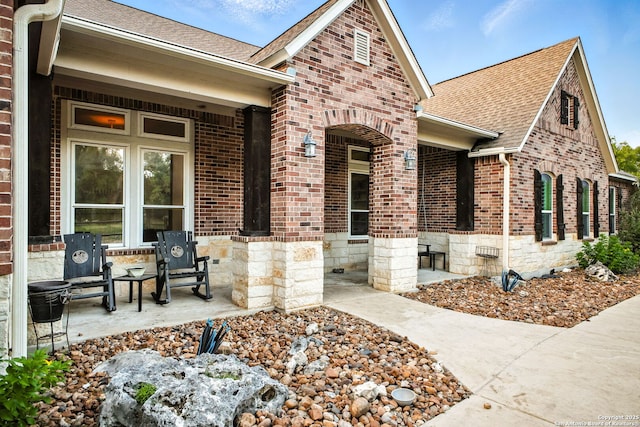1162 Thunder Cloud, Spring Branch, TX 78070 - property entrance with a shingled roof, brick siding, and stone siding