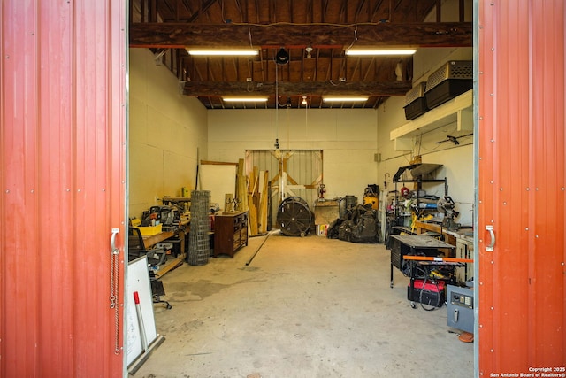 1162 Thunder Cloud, Spring Branch, TX 78070 - garage featuring a workshop area and concrete block wall