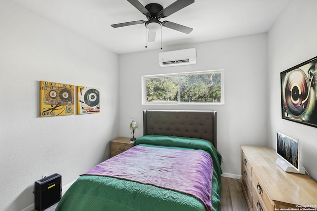 1162 Thunder Cloud, Spring Branch, TX 78070 - bedroom with an AC wall unit, wood finished floors, and ceiling fan