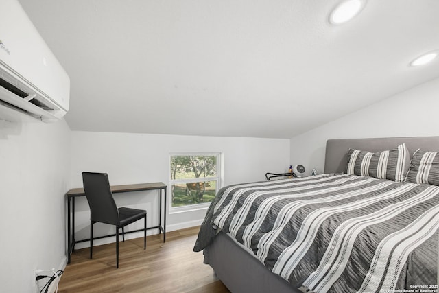 1162 Thunder Cloud, Spring Branch, TX 78070 - bedroom with lofted ceiling, a wall unit AC, wood finished floors, recessed lighting, and a baseboard radiator