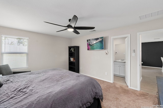 6041 Vestige Bnd, Bulverde, TX 78163 - bedroom featuring light carpet, ceiling fan, and connected bathroom