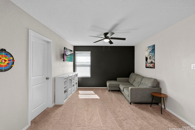6041 Vestige Bnd, Bulverde, TX 78163 - living room with ceiling fan, light colored carpet, and a textured ceiling