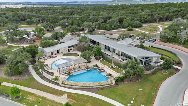 6041 Vestige Bnd, Bulverde, TX 78163 - drone / aerial view of a pool and a heavily wooded area