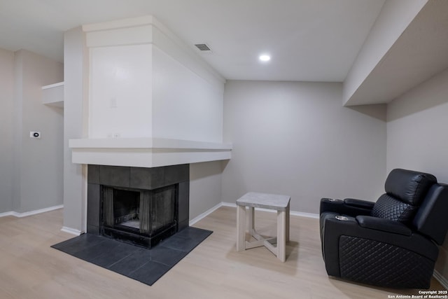 16738 Stoney Glade, San Antonio, TX 78247 - sitting room featuring wood finished floors, a fireplace, and recessed lighting