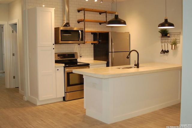 908 Camaron St, San Antonio, TX 78212 - kitchen featuring appliances with stainless steel finishes, open shelves, decorative backsplash, white cabinetry, and light countertops