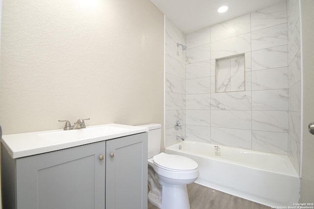 165 N San Felipe, San Antonio, TX 78237 - bathroom with wood finished floors, shower / bath combination, and vanity