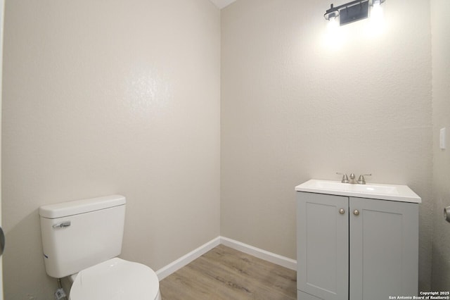 165 N San Felipe, San Antonio, TX 78237 - half bathroom with vanity and wood finished floors