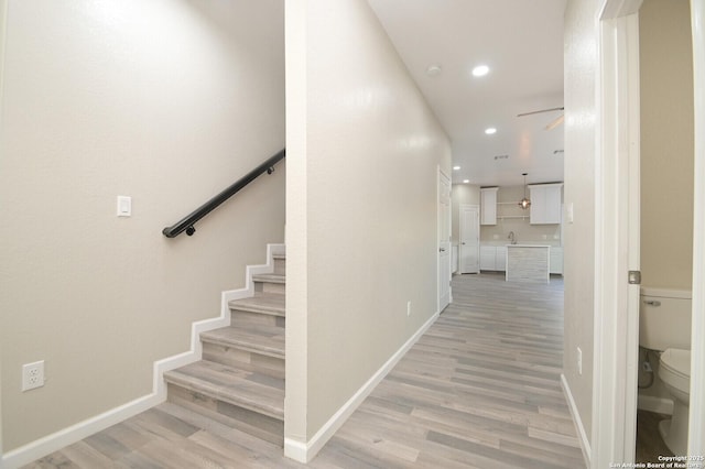 165 N San Felipe, San Antonio, TX 78237 - staircase featuring wood finished floors, recessed lighting, and a ceiling fan