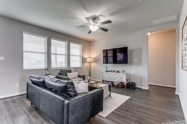 6838 Dashmoor Crk, San Antonio, TX 78244 - living room featuring a ceiling fan and dark wood-type flooring