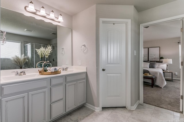 6838 Dashmoor Crk, San Antonio, TX 78244 - full bath featuring connected bathroom, double vanity, a shower stall, and tile patterned floors