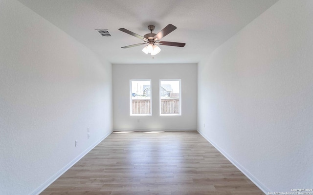 3031 Heidfeld Ln, Converse, TX 78109 - spare room with a ceiling fan and light wood-type flooring