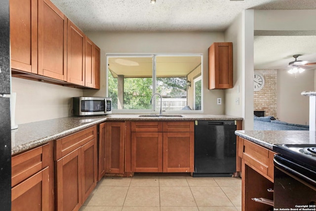 7415 Pipers Ln, San Antonio, TX 78251 - kitchen featuring black dishwasher, stainless steel microwave, a textured ceiling, light tile patterned floors, and ceiling fan