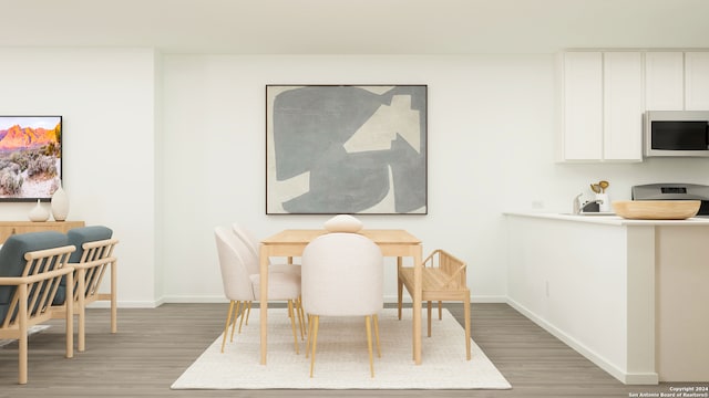 5717 Mangas Cir, Seguin, TX 78155 - dining room with light wood finished floors and baseboards