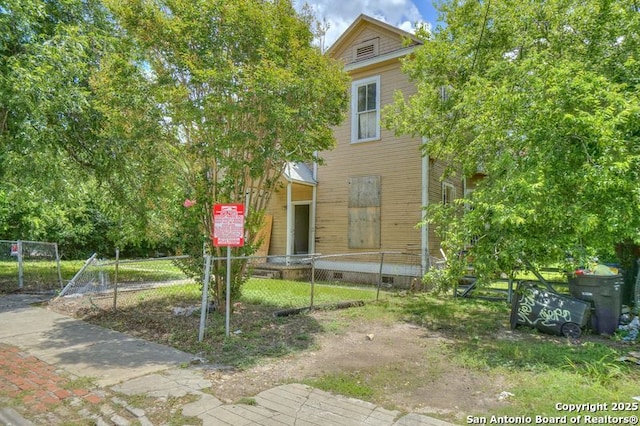 310 E Carson, San Antonio, TX 78208 - view of property hidden behind natural elements with a fenced front yard and a gate