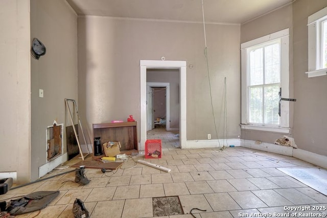 310 E Carson, San Antonio, TX 78208 - tiled empty room with plenty of natural light and crown molding