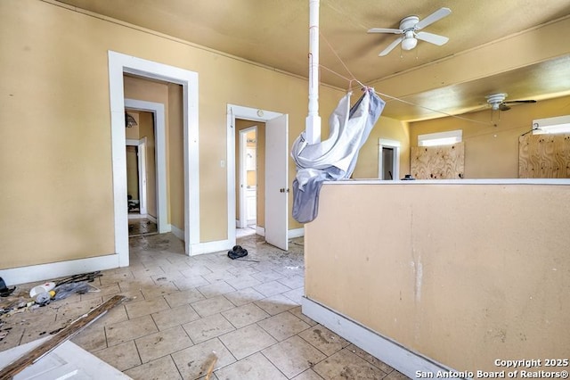 310 E Carson, San Antonio, TX 78208 - tiled spare room with ceiling fan and baseboards
