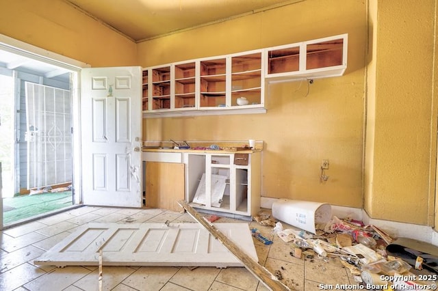 310 E Carson, San Antonio, TX 78208 - kitchen with plenty of natural light, tile patterned flooring, and open shelves