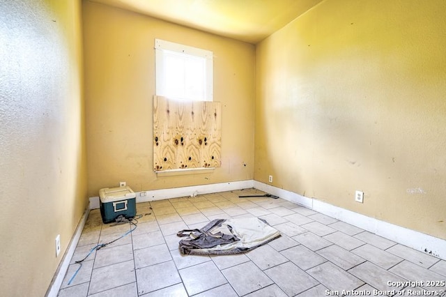 310 E Carson, San Antonio, TX 78208 - unfurnished room featuring tile patterned floors and baseboards