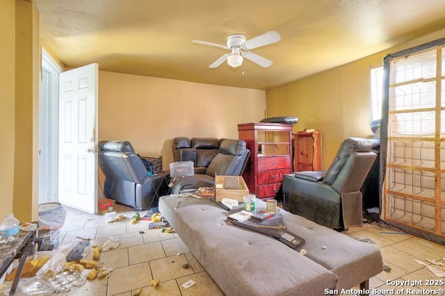 310 E Carson, San Antonio, TX 78208 - living room with light tile patterned floors and a ceiling fan
