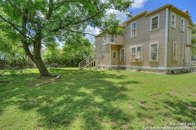 310 E Carson, San Antonio, TX 78208 - back of property featuring stairs and a lawn
