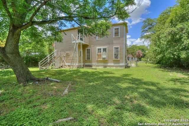310 E Carson, San Antonio, TX 78208 - back of property featuring a yard and stairs