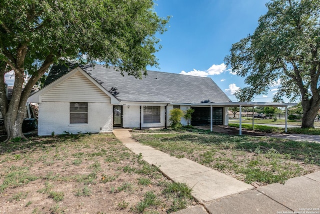 810 Cobble, San Antonio, TX 78216 - view of front of property with brick siding, a carport, and driveway