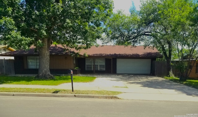 310 Coronet, San Antonio, TX 78216 - view of front of house featuring a garage and driveway