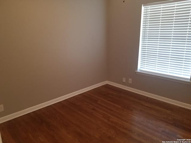 310 Coronet, San Antonio, TX 78216 - empty room featuring dark wood-style floors and baseboards