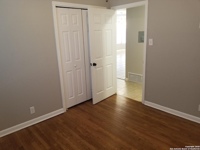 310 Coronet, San Antonio, TX 78216 - unfurnished bedroom with wood finished floors and a closet