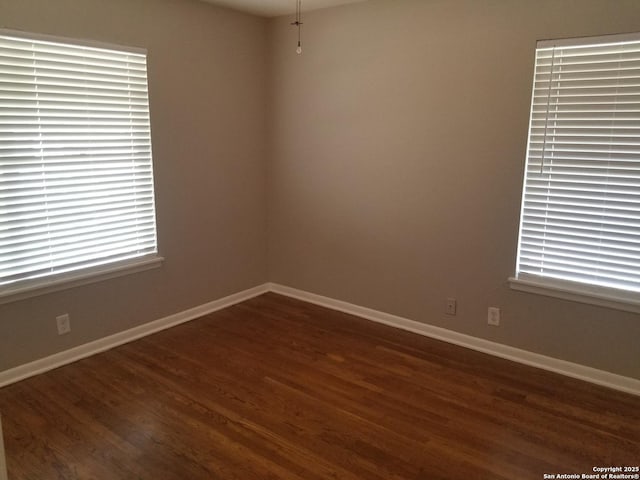 310 Coronet, San Antonio, TX 78216 - unfurnished room featuring dark wood-type flooring