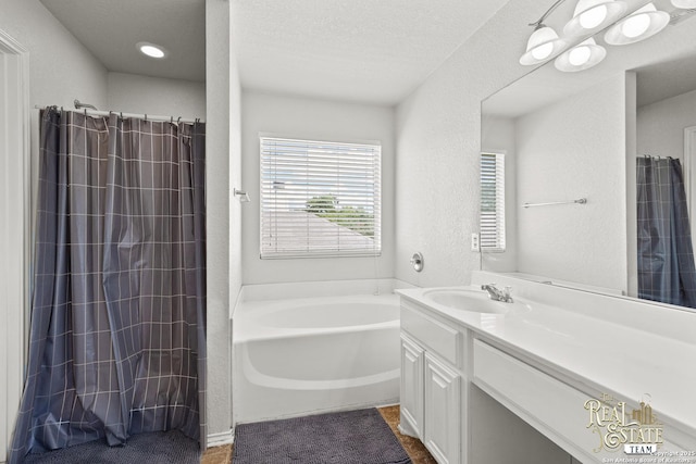 6027 Still Mdw, San Antonio, TX 78222 - full bathroom with a bath, vanity, a textured wall, and a shower with shower curtain
